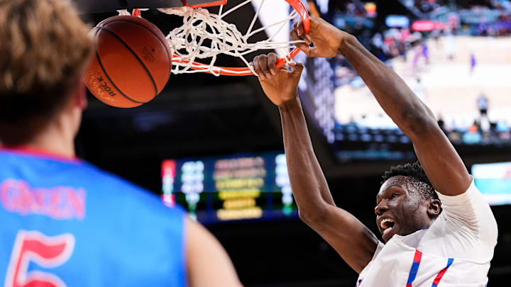 Indiana All-Star Flory Bidunga (1) dunks the ball against Kentucky All-Star Max Green (5) on Saturday, June 8, 2024, during the boys seniors All-Star game at Gainbridge Fieldhouse in Indianapolis. Indiana All-Stars defeated the Kentucky All-Stars.