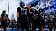 Kansas Jayhawk players warm up before the game against West Virginia Mountaineers at David Booth Kansas Memorial Stadium on Sept. 20, 2025.