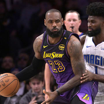 Los Angeles Lakers forward LeBron James (23) is defended by Orlando Magic forward Jonathan Isaac (1) in the first half at Crypto.com Arena.