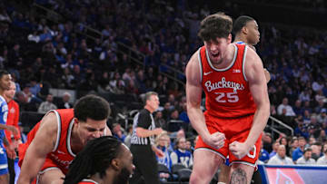 Dec 21, 2024; New York, New York, USA; Ohio State Buckeyes guard John Mobley Jr. (0), Ohio State Buckeyes guard Bruce Thornton (2) and Ohio State Buckeyes center Austin Parks (25) react during the first half against the Kentucky Wildcats at Madison Square Garden. Mandatory Credit: John Jones-Imagn Images