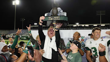 USF coach Alex Golesh celebrated the Bulls' five-overtime win in the Hawaii Bowl but is back on the recruiting trail.