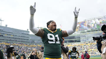 Oct 13, 2024; Green Bay, Wisconsin, USA;  Green Bay Packers defensive lineman Preston Smith (91) celebrates following the game against the Arizona Cardinals at Lambeau Field. Mandatory Credit: Jeff Hanisch-Imagn Images