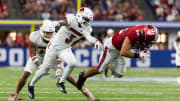 Sep 16, 2023; Indianapolis, Indiana, USA; Indiana Hoosiers tight end Bradley Archer (82) runs the ball against Louisville Cardinals defensive back Quincy Riley (3) 