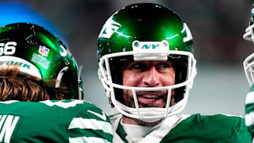 New York Jets quarterback Aaron Rodgers (8) smiles after throwing his fourth touchdown pass of the day, Sunday January 5, 2025, in East Rutherford.