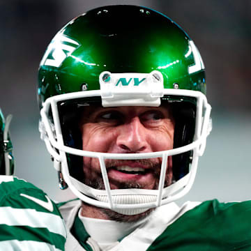 New York Jets quarterback Aaron Rodgers (8) smiles after throwing his fourth touchdown pass of the day, Sunday January 5, 2025, in East Rutherford.
