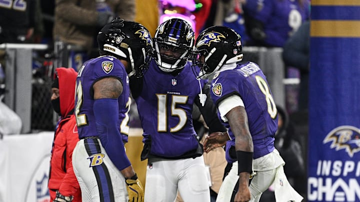 Jan 11, 2025; Baltimore, Maryland, USA; Baltimore Ravens running back Derrick Henry (22) celebrates with wide receiver Nelson Agholor (15) and quarterback Lamar Jackson (8) after scoring a touchdown against the Pittsburgh Steelers in the third quarter in an AFC wild card game at M&T Bank Stadium. Mandatory Credit: Tommy Gilligan-Imagn Images