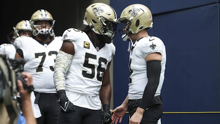 Oct 15, 2023; Houston, Texas, USA; New Orleans Saints linebacker Demario Davis (56) and quarterback Derek Carr (4) prepare to walk onto the field before the game against the Houston Texans at NRG Stadium. Mandatory Credit: Troy Taormina-Imagn Images