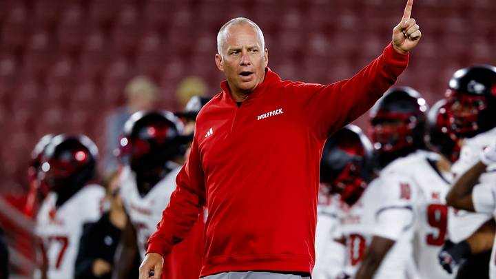 Oct 23, 2026; Stanford, California, USA;  NC State Wolfpack head coach Dave Doeren instructs his players during warmups before the game against the Stanford Cardinal at Stanford Stadium.  Mandatory Credit: Sergio Estrada-Imagn Images