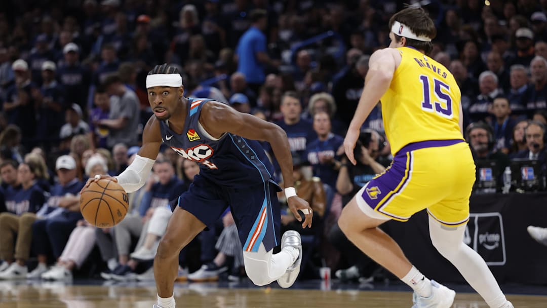 May 7, 2026; Oklahoma City, Oklahoma, USA; Oklahoma City Thunder guard Shai Gilgeous-Alexander (2) drives down the court against Los Angeles Lakers guard Austin Reaves (15) in the second half during game two of the second round of the 2026 NBA Playoffs at Paycom Center. Mandatory Credit: Alonzo Adams-Imagn Images
