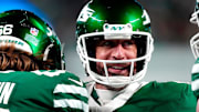 New York Jets quarterback Aaron Rodgers (8) smiles after throwing his fourth touchdown pass of the day, Sunday January 5, 2025, in East Rutherford.
