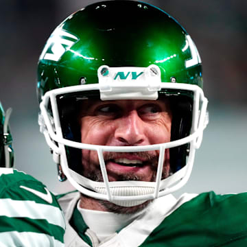 New York Jets quarterback Aaron Rodgers (8) smiles after throwing his fourth touchdown pass of the day, Sunday January 5, 2025, in East Rutherford.