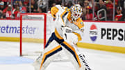 Apr 12, 2024; Chicago, Illinois, USA; Nashville Predators goaltender Kevin Lankinen (32) clears the puck up the ice in the second period against the Chicago Blackhawks at United Center. Mandatory Credit: Jamie Sabau-USA TODAY Sports