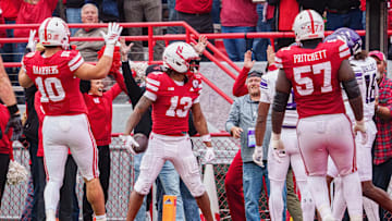 Nebraska Cornhuskers wide receiver Nyziah Hunter (13) celebrates with tight end Heinrich Haarberg (10) and offensive lineman Elijah Pritchett (57) after scoring a touchdown against the Northwestern Wildcats during the third quarter at Memorial Stadium.
