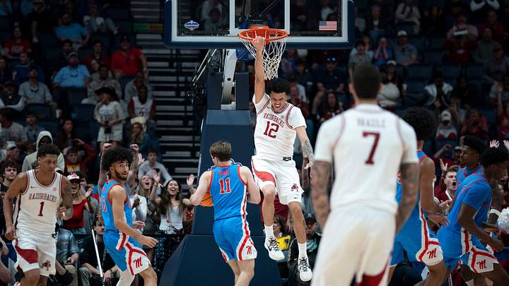 Arkansas forward Malique Ewin (12) finishes off a dunk against Mississippi during their semifinal game of the 2026 SEC Men’s Basketball Tournament at Bridgestone Arena in Nashville, Tenn., Saturday, March 14, 2026.