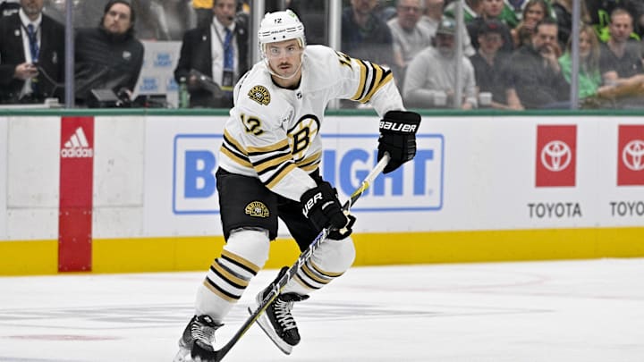 Nov 6, 2023; Dallas, Texas, USA; Boston Bruins defenseman Kevin Shattenkirk (12) in action during the game between the Dallas Stars and the Boston Bruins at the American Airlines Center. Mandatory Credit: Jerome Miron-Imagn Images