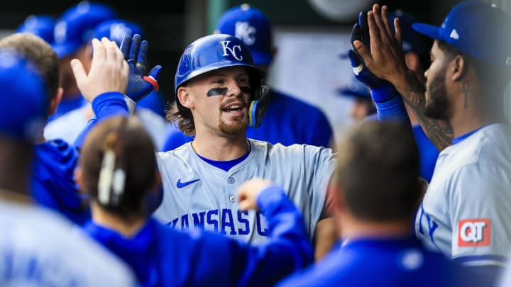 Aug 16, 2024; Cincinnati, Ohio, USA; Kansas City Royals shortstop Bobby Witt Jr. (7) high fives teammates after hitting a solo home run in the fourth inning against the Cincinnati Reds at Great American Ball Park. Mandatory Credit: Katie Stratman-USA TODAY Sports