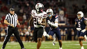 Oct 5, 2024; Tucson, Arizona, USA; Texas Tech Red Raiders running back Tahj Brooks (28) runs with ball while Arizona Wildcats defend during fourth quarter at Arizona Stadium. Mandatory Credit: Aryanna Frank-Imagn Images