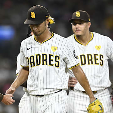 Sep 4, 2024; San Diego, California, USA; San Diego Padres starting pitcher Yu Darvish (11) hands the ball to the manager Mike Shildt as he leaves the game during the third inning against the Detroit Tigers at Petco Park. Mandatory Credit: Denis Poroy-Imagn Images