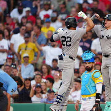 Jul 27, 2024; Boston, Massachusetts, USA; New York Yankees right fielder Alex Verdugo (24) bumps forearms with New York Yankees left fielder Juan Soto (22) to congratulate him for hitting a two-run home run against the Boston Red Sox during the first inning at Fenway Park. Mandatory Credit: Gregory Fisher-Imagn Images