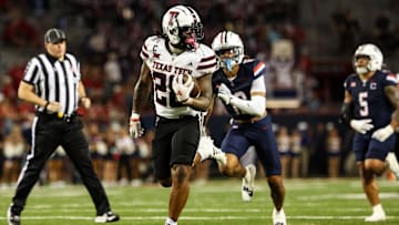 Oct 5, 2024; Tucson, Arizona, USA; Texas Tech Red Raiders running back Tahj Brooks (28) runs with ball while Arizona Wildcats defend during fourth quarter at Arizona Stadium. Mandatory Credit: Aryanna Frank-Imagn Images