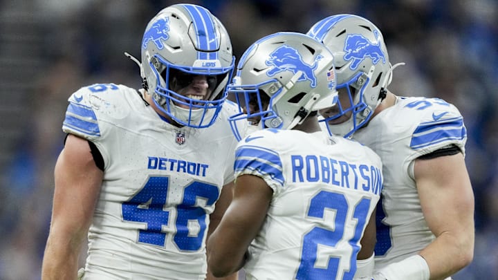  Detroit Lions linebacker Jack Campbell (46), Detroit Lions cornerback Amik Robertson (21), and Detroit Lions linebacker Trevor Nowaske (53) react after a play at Lucas Oil Stadium.
