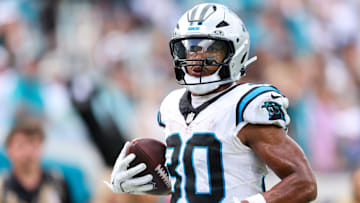 Sep 7, 2025; Jacksonville, Florida, USA; Carolina Panthers running back Chuba Hubbard (30) runs after the catch 27-yard touchdown reception during the second half against the Jacksonville Jaguars at EverBank Stadium. Mandatory Credit: Morgan Tencza-Imagn Images