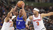 Nov 22, 2025; Orlando, Florida, USA; Orlando Magic guard Desmond Bane (3) drives to the basket past New York Knicks guard Jalen Brunson (11) and guard Josh Hart (3) in the fourth quarter at Kia Center. Mandatory Credit: Nathan Ray Seebeck-Imagn Images