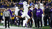 Nov 23, 2024; Ann Arbor, Michigan, USA;  Northwestern Wildcats wide receiver A.J. Henning (8) tries to make a catch against the Michigan Wolverines at Michigan Stadium. Mandatory Credit: Rick Osentoski-Imagn Images