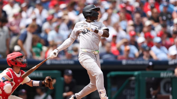 Jul 31, 2024; Philadelphia, Pennsylvania, USA;  New York Yankees third base Jazz Chisholm Jr. (13) hits a single during the second inning against the Philadelphia Phillies at Citizens Bank Park. Mandatory Credit: Bill Streicher-USA TODAY Sports