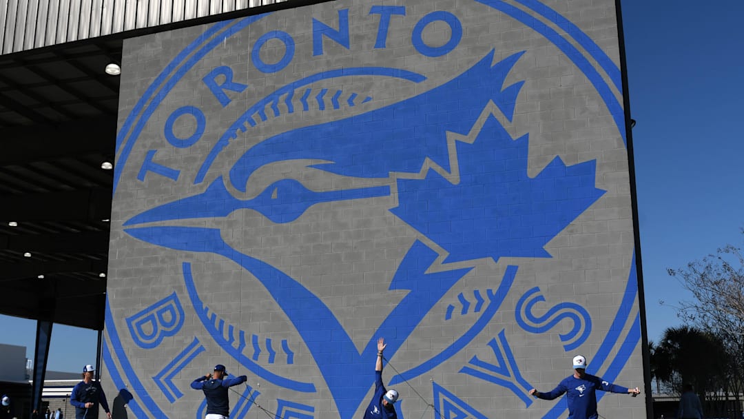 Feb 21, 2024; Dunedin, FL, USA; Members of the Toronto Blue Jays warm up at the Blue Jays Player Development Complex. Mandatory Credit: Jonathan Dyer-Imagn Images