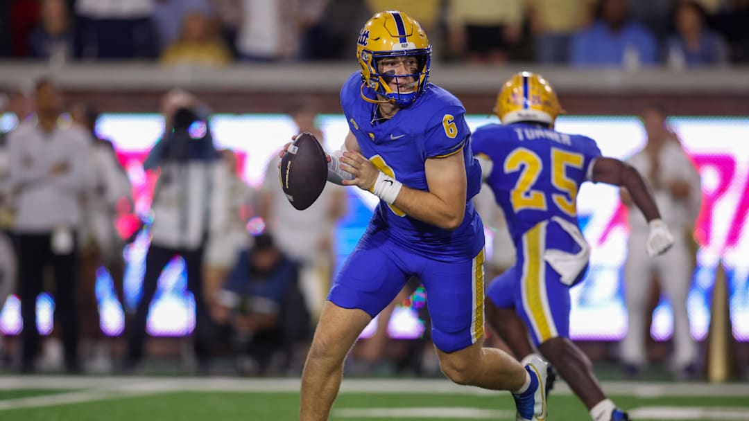 Nov 22, 2025; Atlanta, Georgia, USA; Pittsburgh Panthers quarterback Mason Heintschel (6) rolls out to pass against the Georgia Tech Yellow Jackets in the second quarter at Bobby Dodd Stadium at Hyundai Field. Mandatory Credit: Brett Davis-Imagn Images