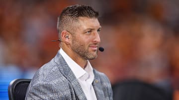 Aug 30, 2025; Atlanta, Georgia, USA; SEC Network analyst Tim Tebow on the field before a game between the Tennessee Volunteers and Syracuse Orange at Mercedes-Benz Stadium. Mandatory Credit: Brett Davis-Imagn Images
