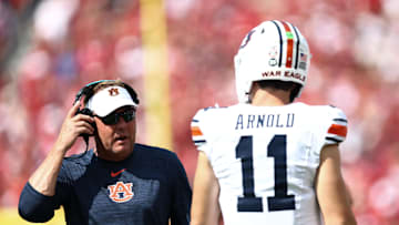 Sep 20, 2025; Norman, Oklahoma, USA;  Auburn Tigers head coach Hugh Freeze speaks with Auburn Tigers quarterback Jackson Arnold (11) during the first half against the Oklahoma Sooners at Gaylord Family-Oklahoma Memorial Stadium. Mandatory Credit: Kevin Jairaj-Imagn Images