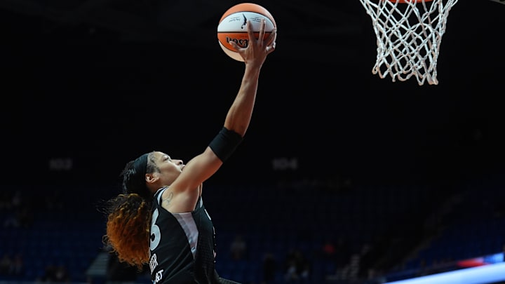 May 13, 2026; Uncasville, Connecticut, USA; Las Vegas Aces guard Chennedy Carter (23) drives to the basket against the Connecticut Sun in the second half at Mohegan Sun Arena. Mandatory Credit: David Butler II-Imagn Images