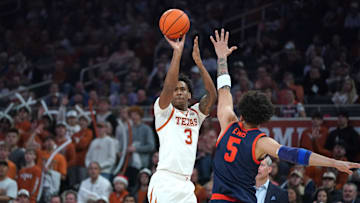 Dec 3, 2025; Austin, Texas, USA; Texas Longhorns guard Dailyn Swain (3) shoots a three point basket against Virginia Cavaliers guard Sam Lewis (5) during the first half at Moody Center. Mandatory Credit: Dustin Safranek-Imagn Images