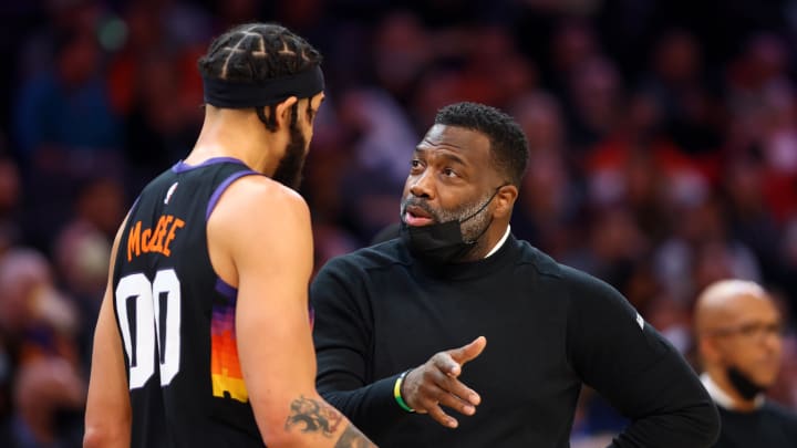 Jan 22, 2022; Phoenix, Arizona, USA; Phoenix Suns center JaVale McGee (00) talks with assistant coach Mark Bryant against the Indiana Pacers at Footprint Center. Mandatory Credit: Mark J. Rebilas-USA TODAY Sports
