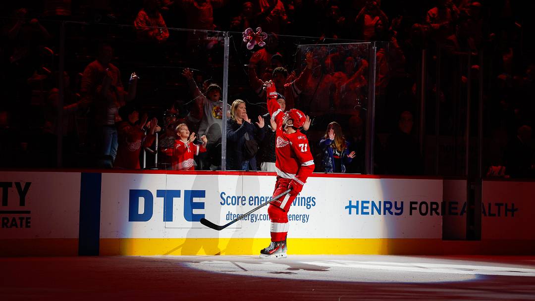 Jan 16, 2026; Detroit, Michigan, USA; Detroit Red Wings center Dylan Larkin (71) throws a stuffed octopus into the crowd following the Red Wings win over the San Jose Sharks at Little Caesars Arena. Mandatory Credit: Brian Bradshaw Sevald-Imagn Images