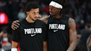 Oct 10, 2025; Portland, Oregon, USA;  Portland Trail Blazers forward Toumani Camara (33) and guard Shaedon Sharpe (17) share a moment before playing in a game against Sacramento Kings at Moda Center. Mandatory Credit: Jaime Valdez-Imagn Images