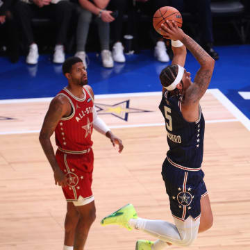Eastern Conference forward Paolo Banchero (5) of the Orlando Magic dunks the ball past Western Conference forward Paul George (13) of the LA Clippers during the second quarter in the 73rd NBA All Star game at Gainbridge Fieldhouse. 