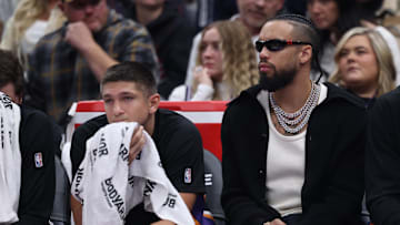 Oct 27, 2025; Salt Lake City, Utah, USA; Phoenix Suns guard Grayson Allen (left) and forward Dillon Brooks (right) watch the game against the Utah Jazz from the bench during the second quarter at Delta Center. Mandatory Credit: Rob Gray-Imagn Images