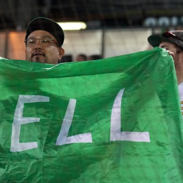 May 3, 2024; Oakland, California, USA; An Oakland Athletics fan holds up a Sell flag during the ninth inning against the Miami Marlins at Oakland-Alameda County Coliseum. Mandatory Credit: Darren Yamashita-USA TODAY Sports