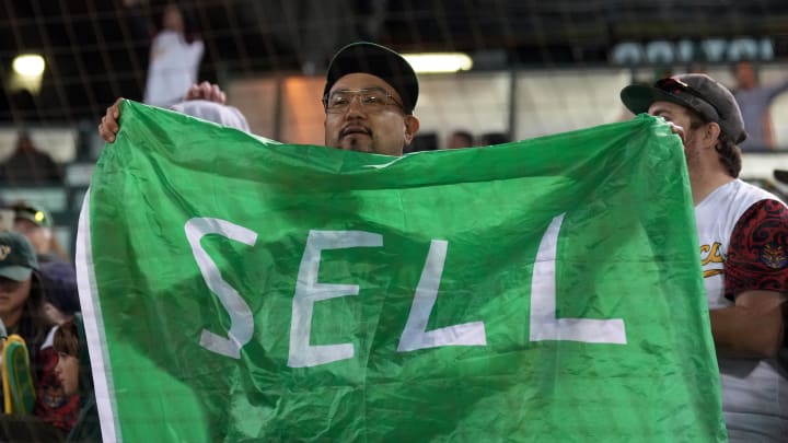 May 3, 2024; Oakland, California, USA; An Oakland Athletics fan holds up a Sell flag during the ninth inning against the Miami Marlins at Oakland-Alameda County Coliseum. Mandatory Credit: Darren Yamashita-USA TODAY Sports