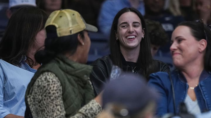 Indiana Fever Caitlin Clark smiles while talking to Butler Bulldogs fans on Monday during the game at Hinkle Fieldhouse in Indianapolis. Indiana Fever Caitlin Clark smiles while talking to Butler Bulldogs fans on Monday during the game at Hinkle Fieldhouse in Indianapolis.