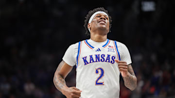 Mar 12, 2025; Kansas City, MO, USA; Kansas Jayhawks guard AJ Storr (2) reacts after a play during overtime against the UCF Knights at T-Mobile Center.
