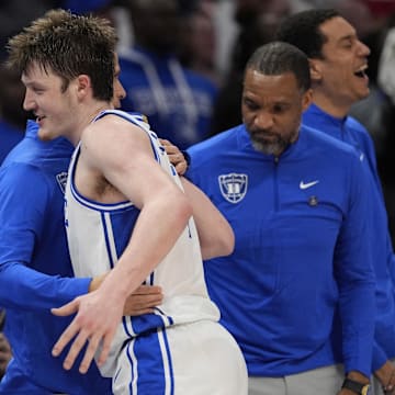 Mar 15, 2025; Charlotte, NC, USA; Duke Blue Devils guard Kon Knueppel (7) celebrates with teammates after winning the 2025 ACC Conference Championship game against the Louisville Cardinals at Spectrum Center. Mandatory Credit: Jim Dedmon-Imagn Images