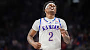 Mar 12, 2025; Kansas City, MO, USA; Kansas Jayhawks guard AJ Storr (2) reacts after a play during overtime against the UCF Knights at T-Mobile Center. Mandatory Credit: William Purnell-Imagn Images