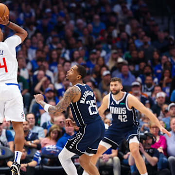 Apr 28, 2024; Dallas, Texas, USA;  LA Clippers guard Norman Powell (24) shoots over Dallas Mavericks forward P.J. Washington (25) during the first quarter during game four of the first round for the 2024 NBA playoffs at American Airlines Center.