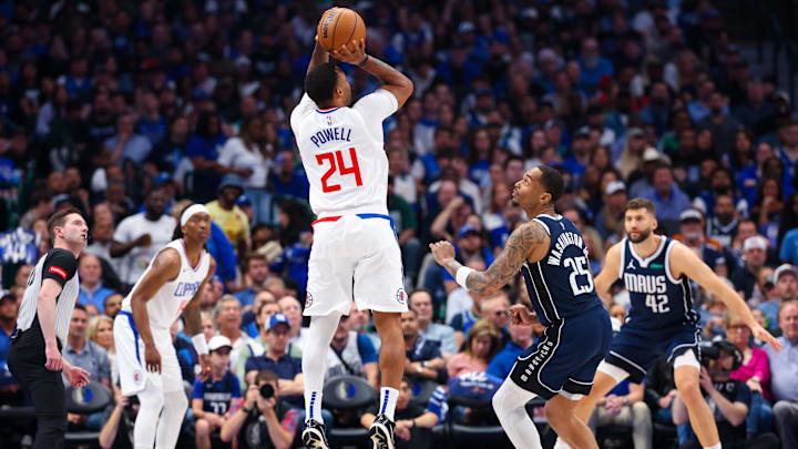 Apr 28, 2024; Dallas, Texas, USA;  LA Clippers guard Norman Powell (24) shoots over Dallas Mavericks forward P.J. Washington (25) during the first quarter during game four of the first round for the 2024 NBA playoffs at American Airlines Center.