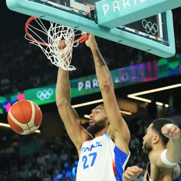 Aug 10, 2024; Paris, France; France centre Rudy Gobert (27) dunks against United States in the men's basketball gold medal game during the Paris 2024 Olympic Summer Games at Accor Arena. Mandatory Credit: Rob Schumacher-USA TODAY Sports