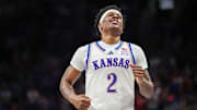 Mar 12, 2025; Kansas City, MO, USA; Kansas Jayhawks guard AJ Storr (2) reacts after a play during overtime against the UCF Knights at T-Mobile Center. Mandatory Credit: William Purnell-Imagn Images